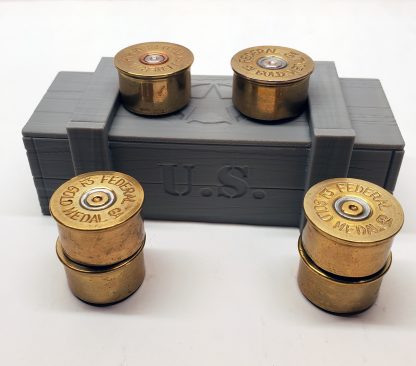 Six 12 gauge shotgun shell fridge magnets on top of miniature ammo box